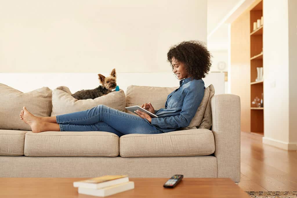 Woman and Dog on Couch
